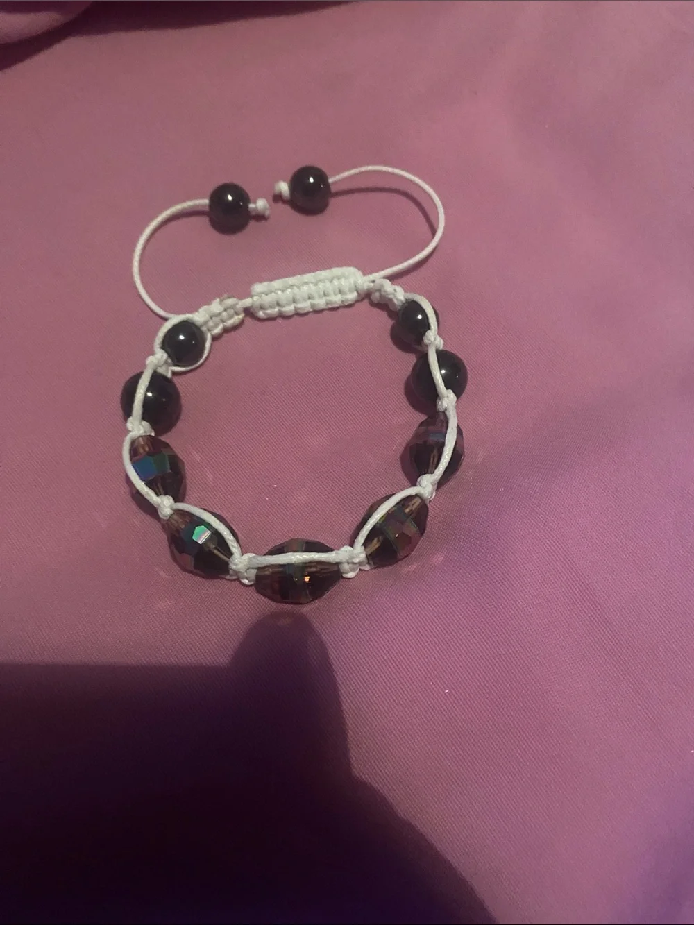 Hand-Knotted White Cord Bracelet with Dark Iridescent Beads
